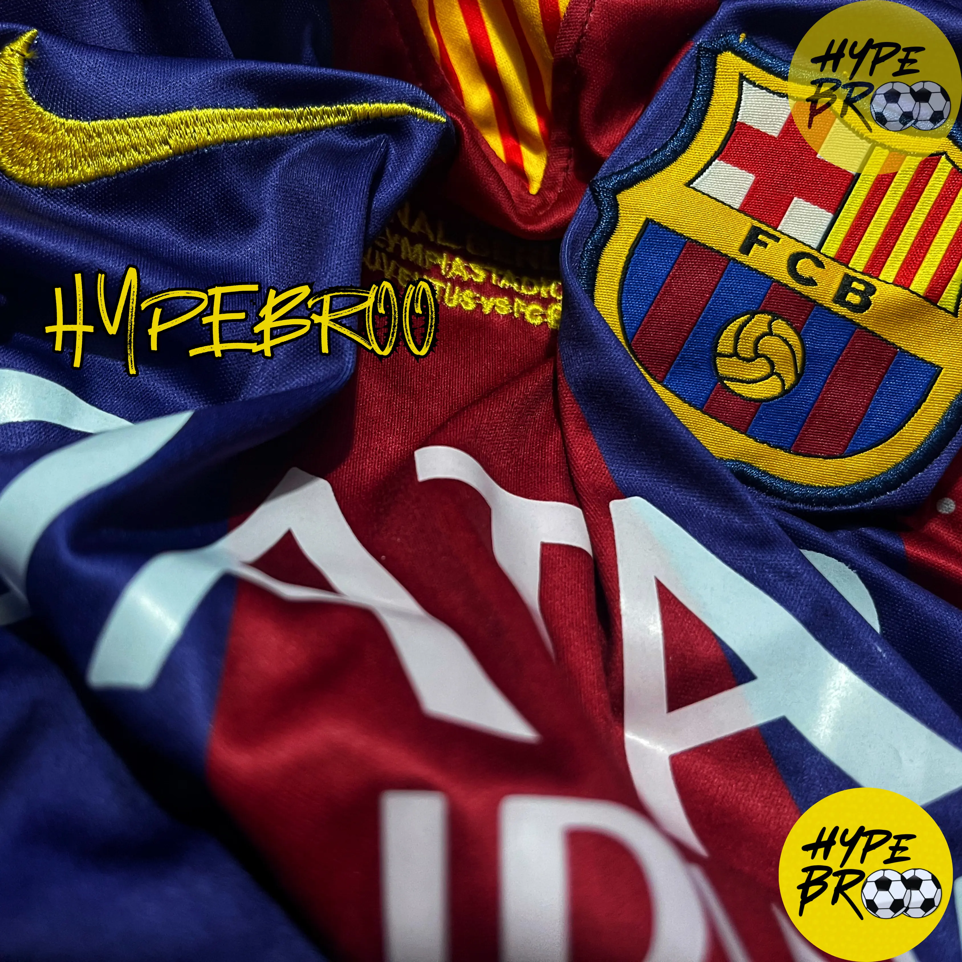 Close-up of Barcelona crest, Nike swoosh, and embroidered UCL Final date on 2014-15 home kit
