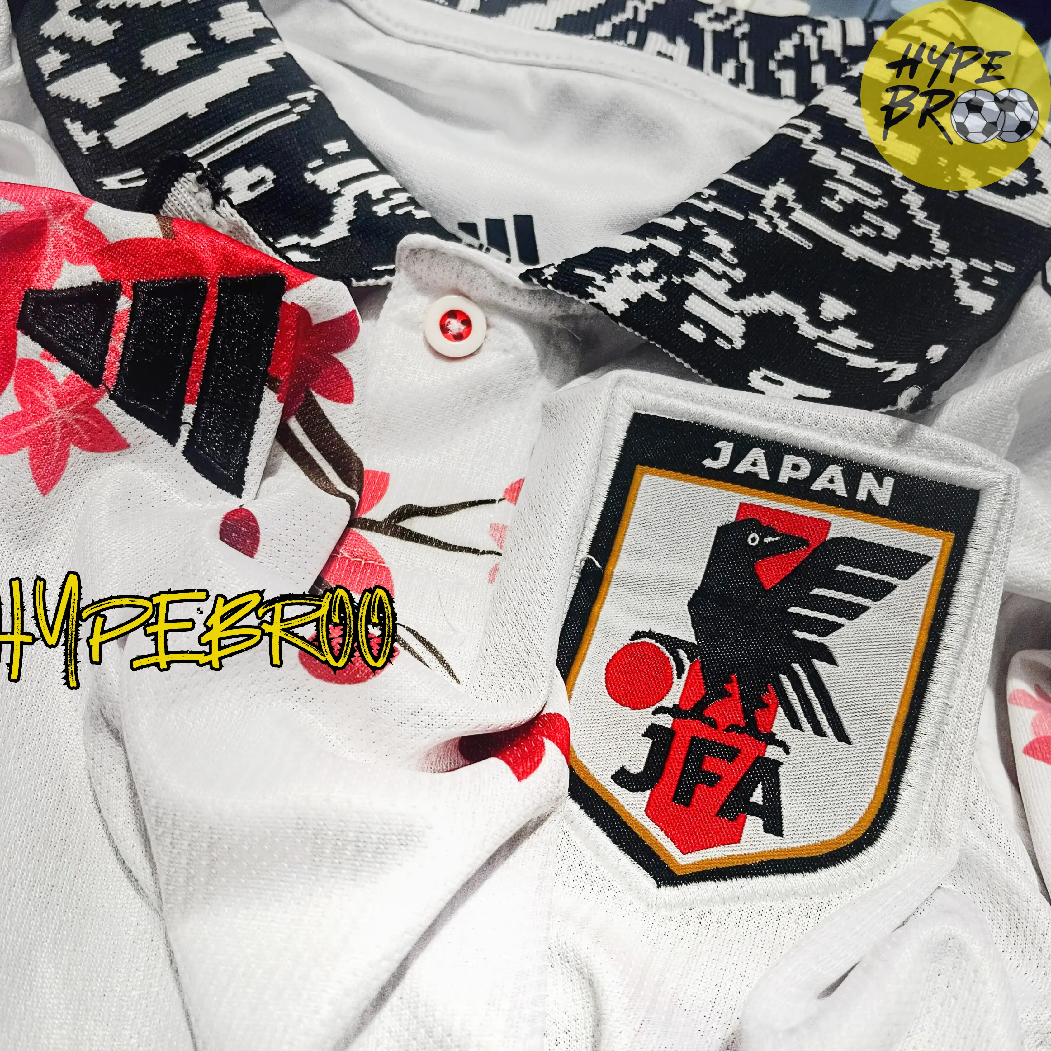 Close-up of Japan concept kit crest and Adidas logo on jersey